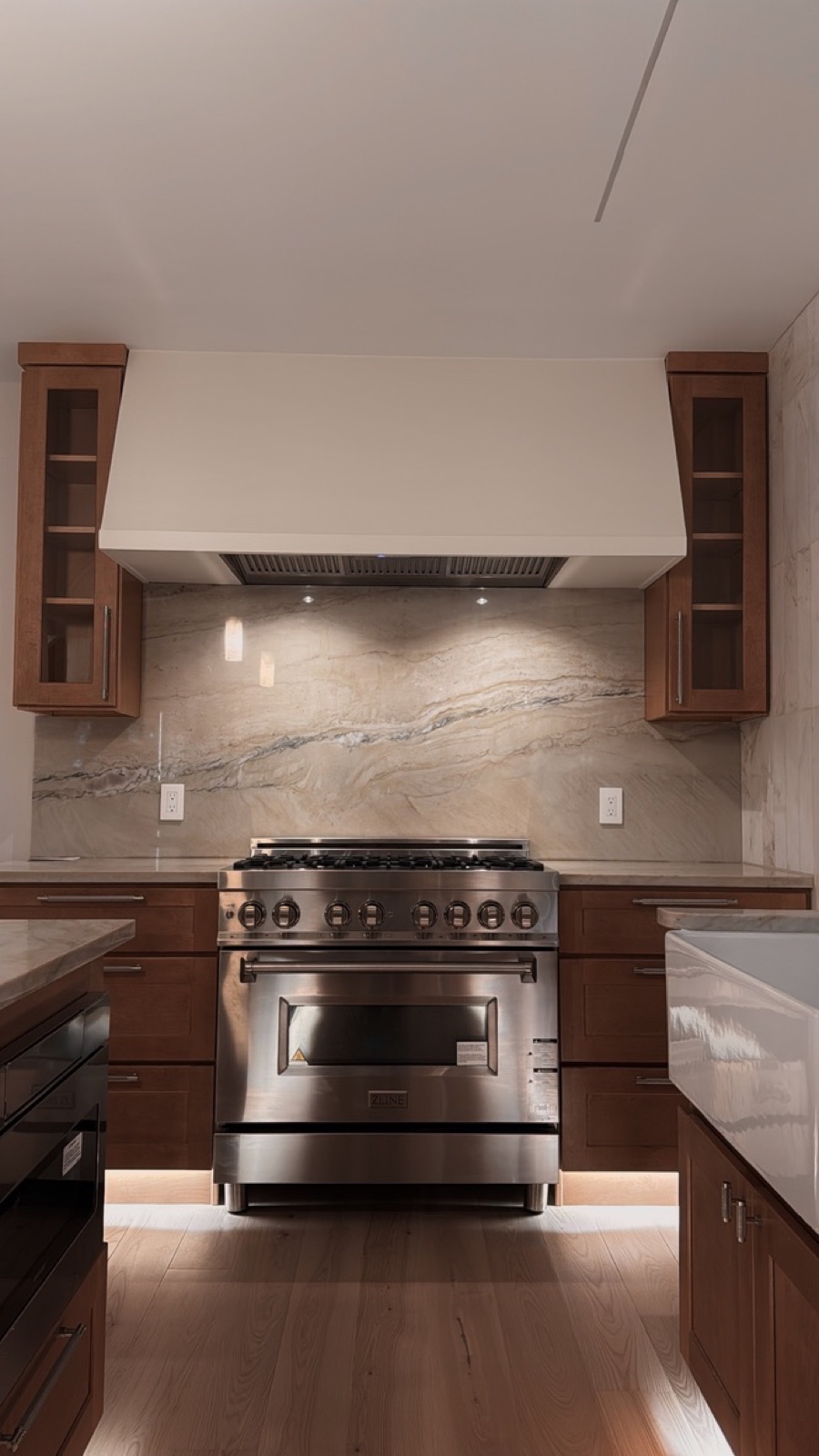 Unbroken marble at the range — a material chosen for the company it keeps