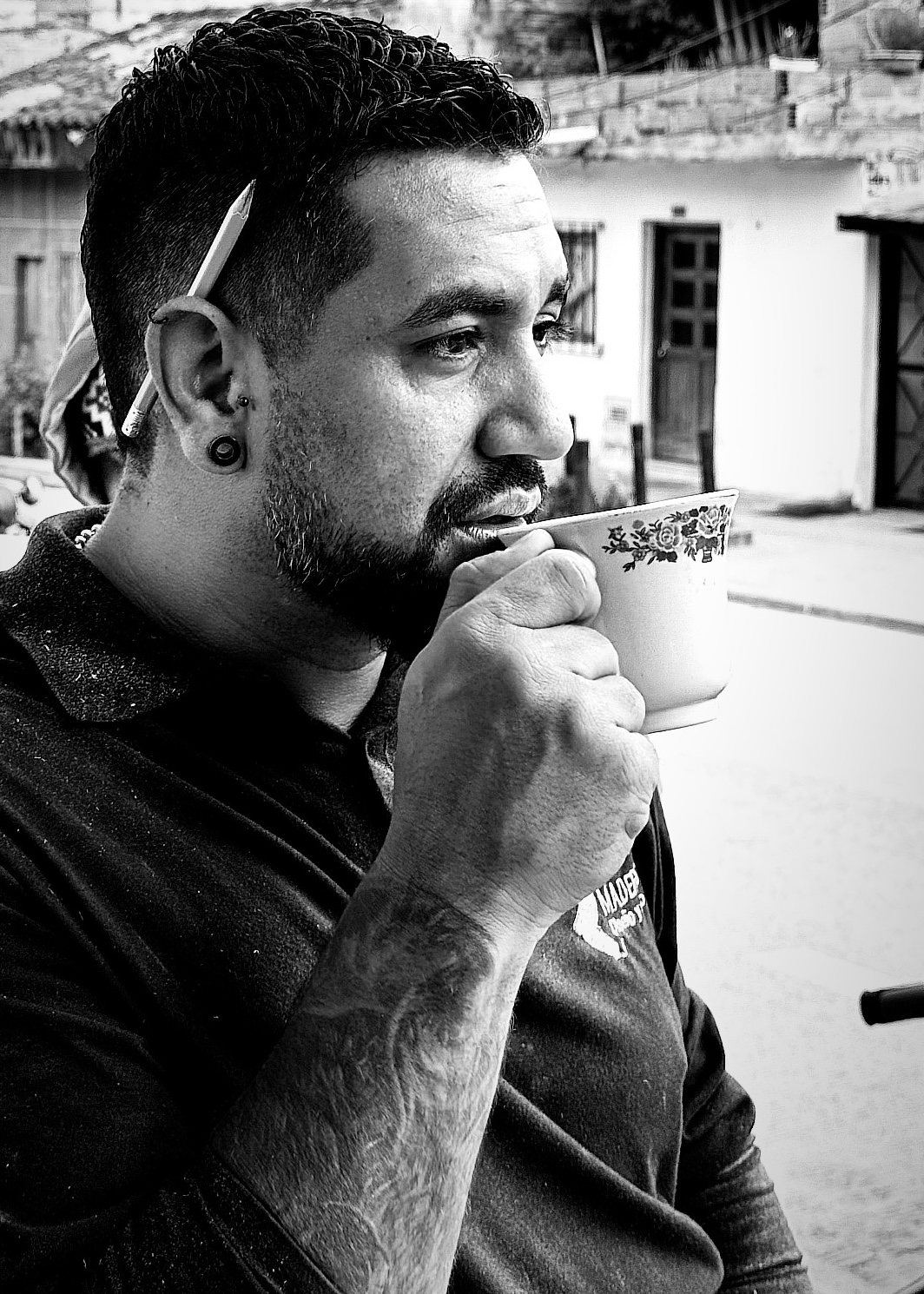 A builder at work on a More Life home, black and white.