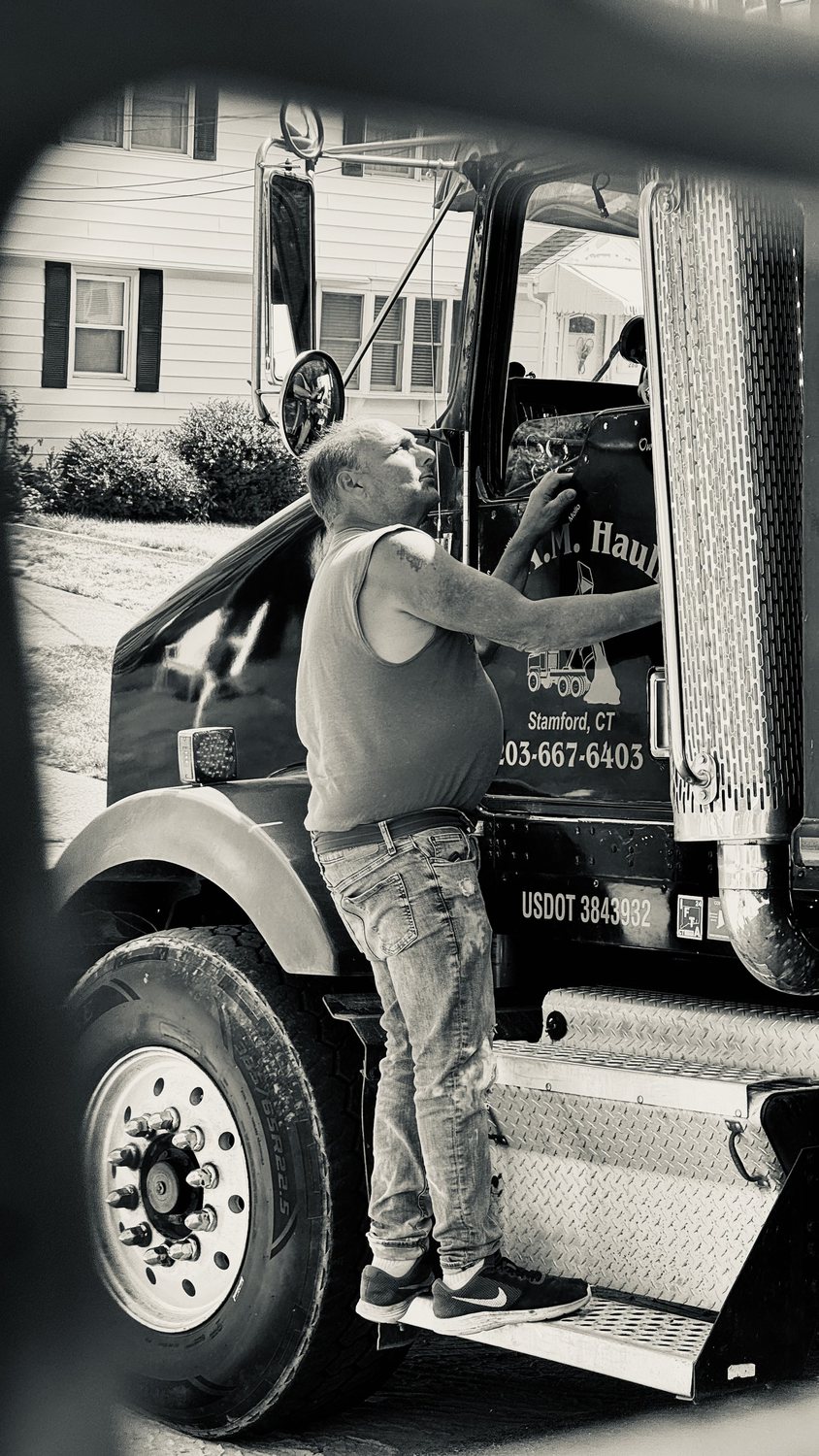 A builder at work on a More Life home, black and white.