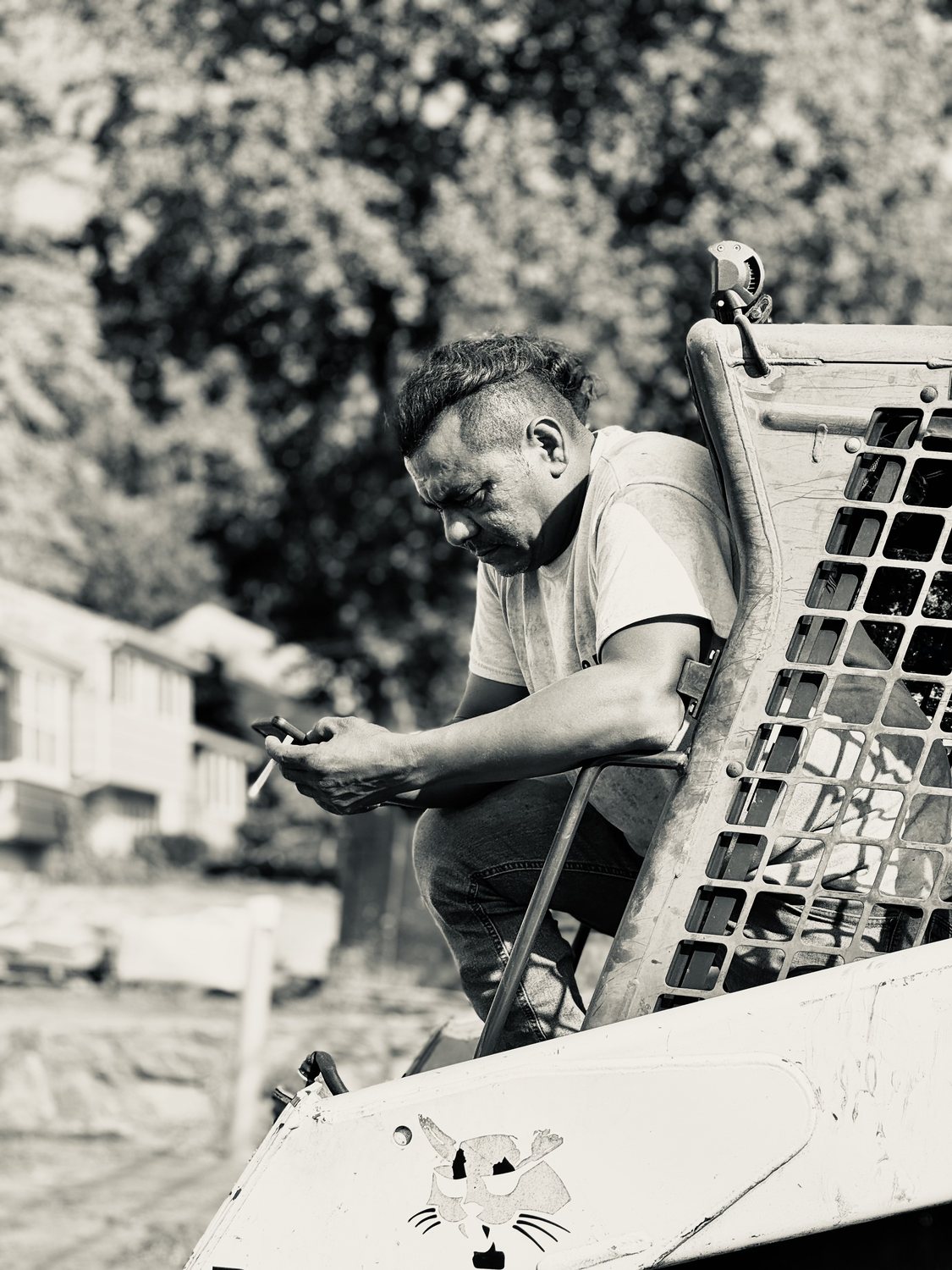 A builder at work on a More Life home, black and white.